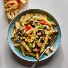 Wild Mushroom, vegetable alfredo with herb garlic penne and sliced garlic bread 